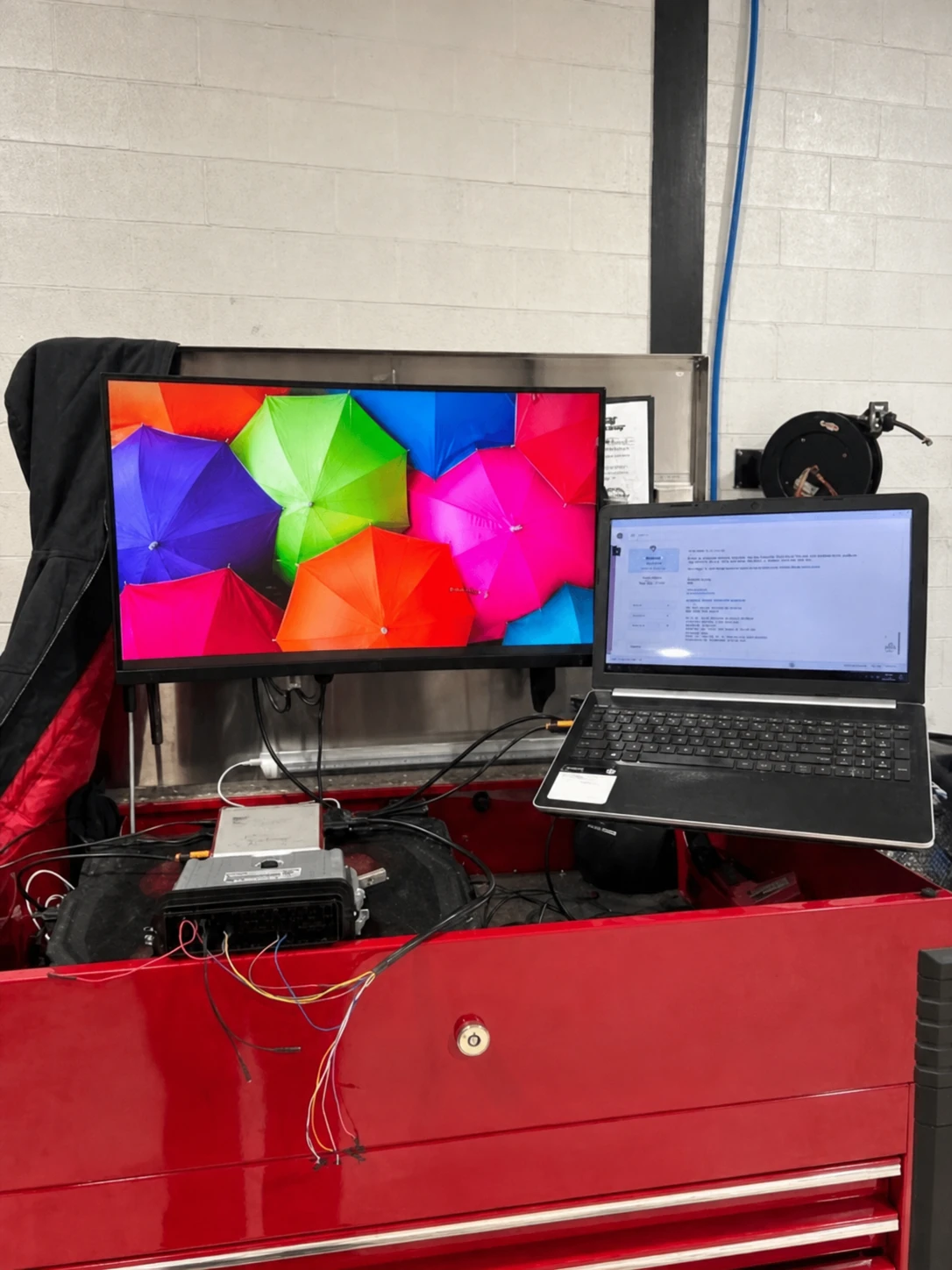Photographed Cedar Performance workstation with the bench-patch tool used for OBD unlock service