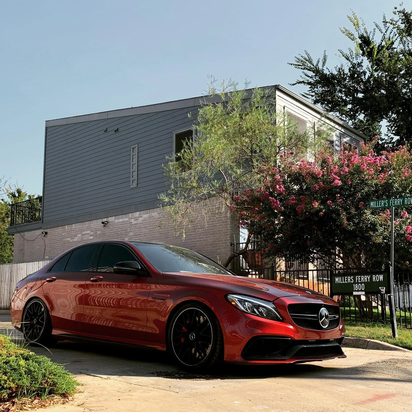 Red Mercedes-AMG C63 sedan at Miller's Ferry Row in Dallas