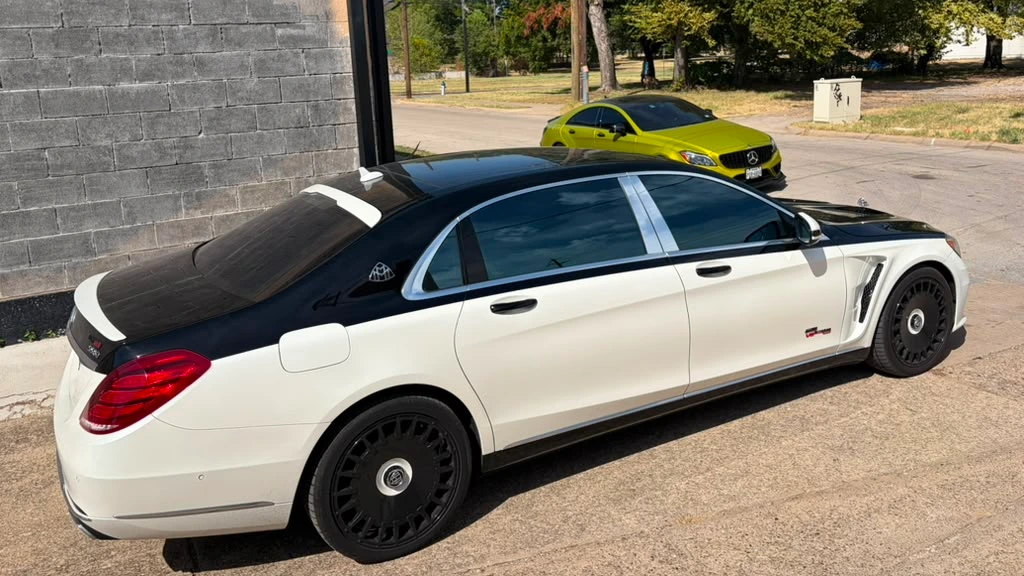 Two-tone Mercedes and yellow Mercedes photographed outside Cedar Performance in Dallas