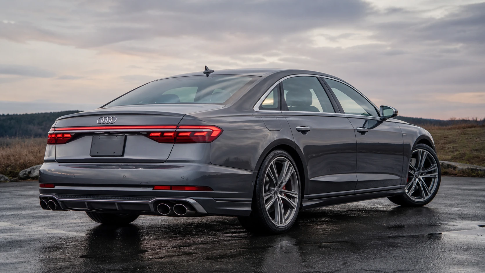 Gray D5 Audi S8 in a rear three-quarter view with S8-specific quad exhaust