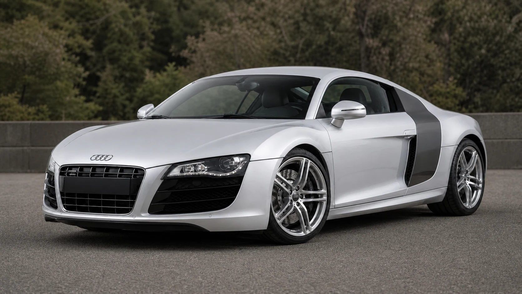 Silver first-generation Audi R8 at a paved turnout